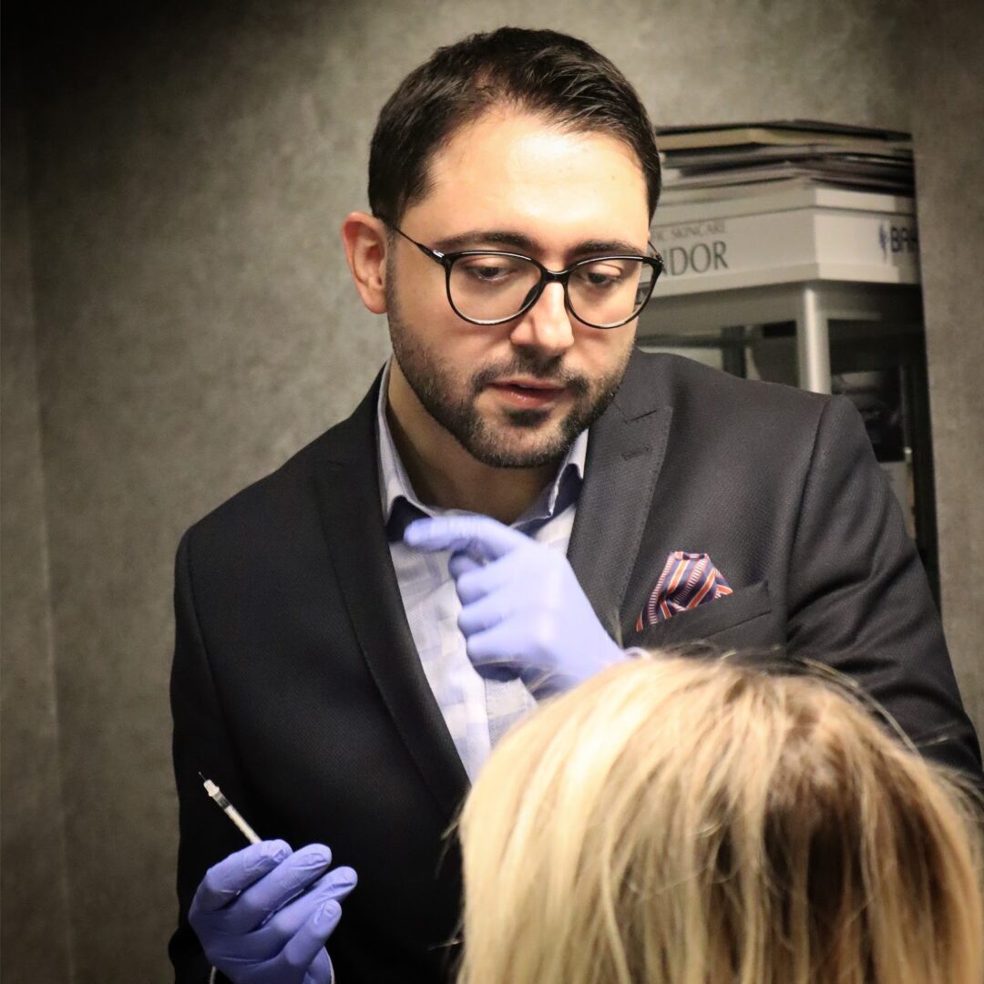 Dr. Mehmet Sürmeli during an in-person patient consultation